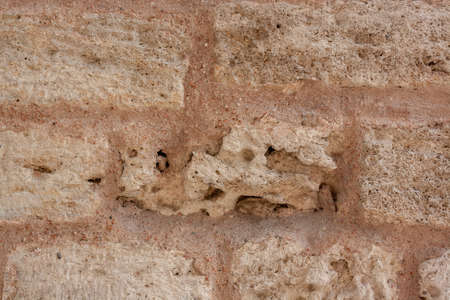 Antique masonry closeup from old blocks and mortar.