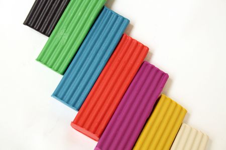 Coloured plasticine lying on white backgroundの写真素材