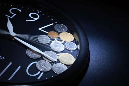 Round clock with mooving second hand and money as dark background