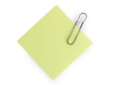Isolated yellow paper with steel clip for your notesの写真素材