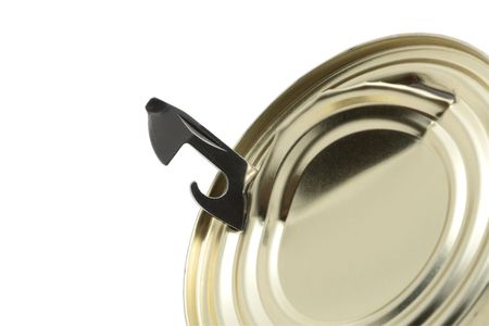 Close-up of can opener inside tin isolated on white backgroundの写真素材