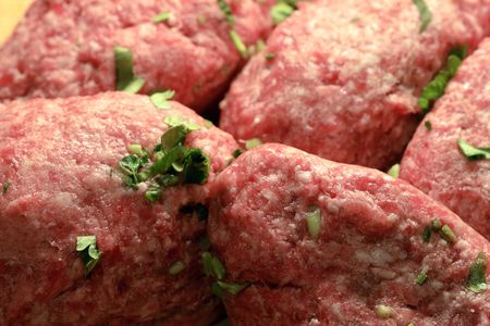 Close-up of raw meat rissoles background