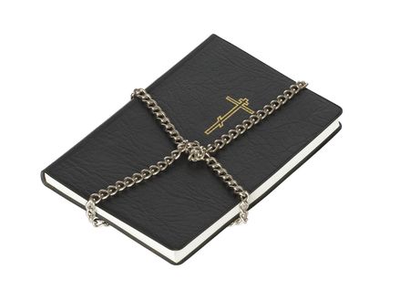 Black Bible constrained with steel chain isolated on whiteの写真素材