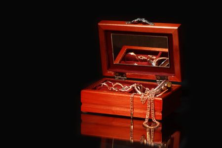 Nice wooden casket with jewelry on dark backgroundの写真素材