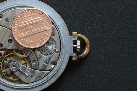 USA one cent coin lying on watch mechanismの写真素材
