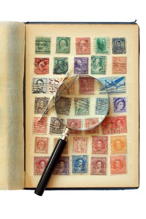 Old stamp album isolated on white backgroundの写真素材