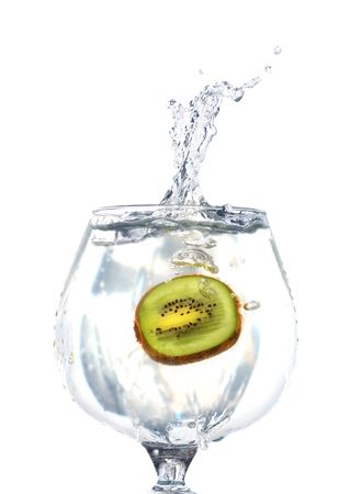 Kiwi fruit inside goblet of splashing water isolated with clippingの写真素材