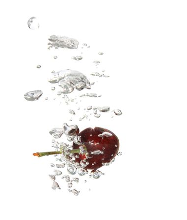 Cherry on abstract splashing water background isolatedの写真素材