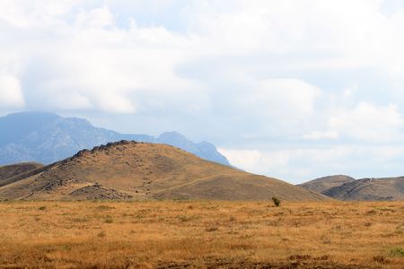Nice Crimea summer landscape with yellow steppe and mountains