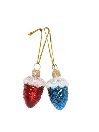 Two Christmas ball like a fir cones hangingの写真素材