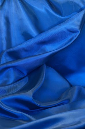 Background made from nice smooth blue textileの写真素材