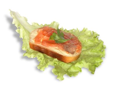 Sandwich with butter and fish lying on lettuce leafの写真素材