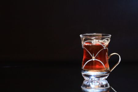 Nice cup of black tea isolated on dark with copy spaceの写真素材