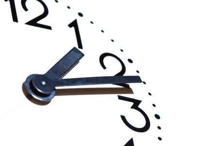 Extreme closeup of clock dial on white background with copy spaceの写真素材