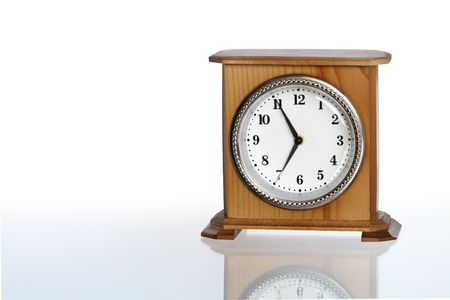 Wooden alarm clock isolated on white background 