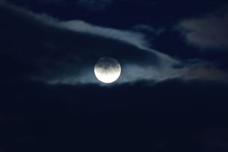 Full moon and clouds on night sky backgroundの写真素材