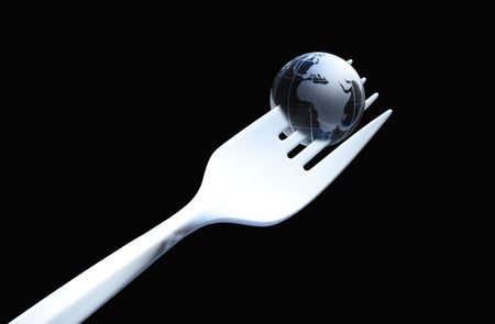 Composition with white plastic fork and glass globe on dark background with copy spaceの写真素材