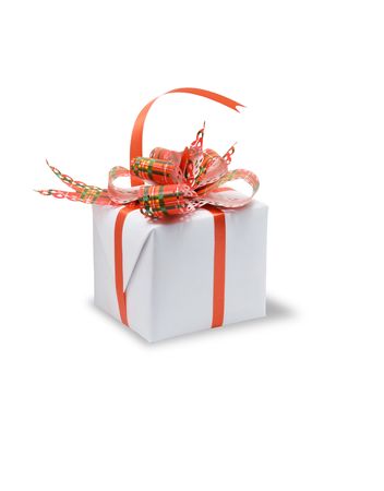 A white box tied with a colored ribbon bow. Isolated on white の写真素材
