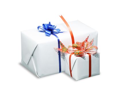 Two white boxes tied with a colored ribbon bows. Isolated on white の写真素材
