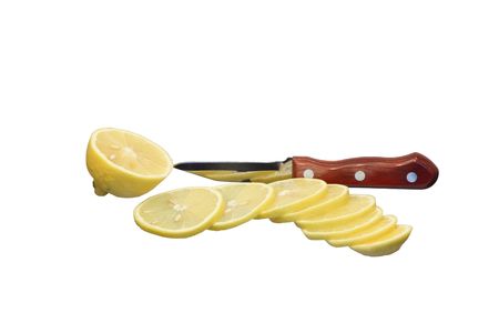 Sliced lemon and knife isolated on white backgroundの写真素材
