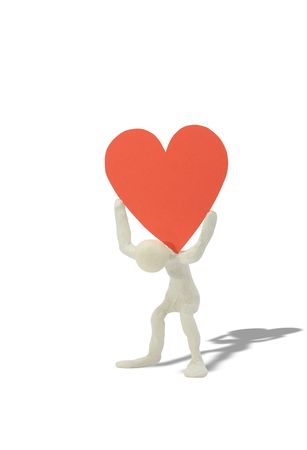 Plasticine man with big red heart on his shoulders.の写真素材