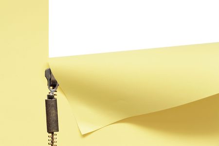 Brass zipper on yellow paper background for your design ideas. の写真素材