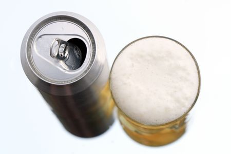 Closeup of beer glass and can on white backgroundの写真素材