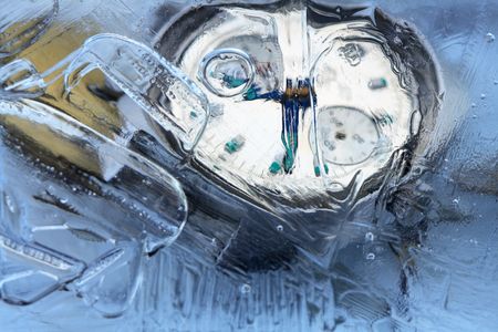 Closeup of wrist watch and water drops inside iceの写真素材