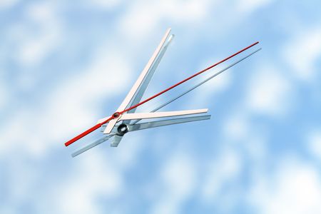 Clock hands lying on mirror background with blue sky and clouds reverberationの写真素材