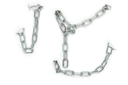 Abstract background made from metal chain hanging on white paper sheet with holesの写真素材