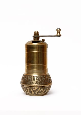 Vintage bronze brass pepper mill isolated on white background の写真素材