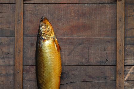 Closeup of fresh bloater lying on wooden backgroundの写真素材