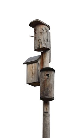 Three wooden starling-houses isolated on white background with clipping pathの写真素材