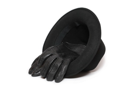 Felt hat and pair of leather gloves on white backgroundの写真素材