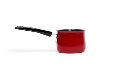 Small red saucepan with long handle isolated on white background. Clipping path is includedの写真素材