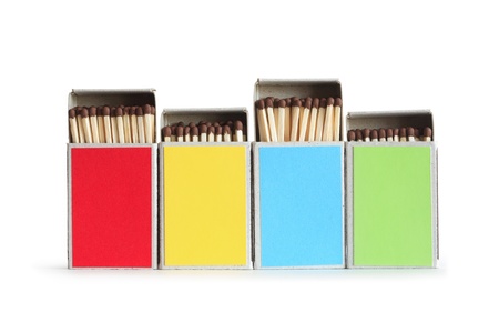Few variegated matchboxes in a row isolated on white background.の写真素材