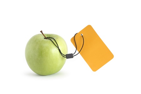 Freshness green apple with blank yellow paper label on white background. Isolated with clipping pathの写真素材
