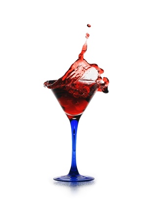 Red splashing cocktail isolated on white background with clipping pathの写真素材