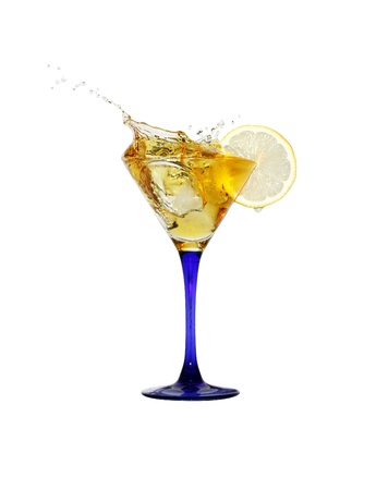 Splashing cocktail with ice and lemon isolated on white background with clipping pathの写真素材