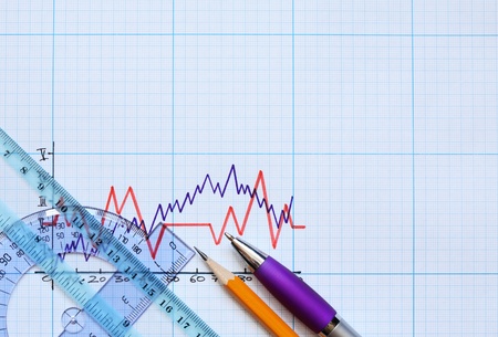 Rulers and pencil on graph paper with diagramの写真素材