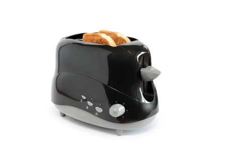Two toasts inside black toaster on white background.の写真素材