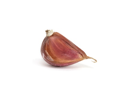 One clove of garlic on white backgroundの写真素材