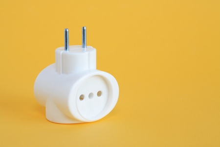 Pair of plastic socket outlet on yellow background with free space for textの写真素材