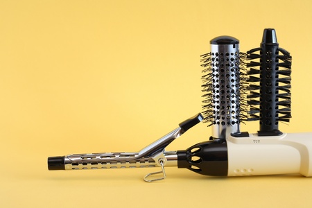 Hairdressing set with various accessories on yellow backgroundの写真素材
