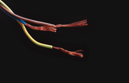 Abstract composition with knotted colored wire on dark backgroundの写真素材