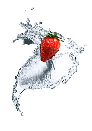 Red strawberry inside flowing water on white backgroundの写真素材