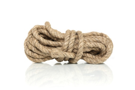 Skein of old hemp rope on white background