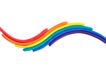 Various color plasticine as wave on white background. Isolated with clipping path