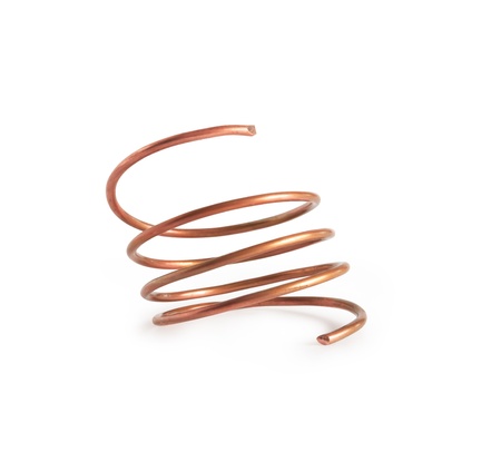 Copper wire spring on white background. Clipping path is includedの写真素材