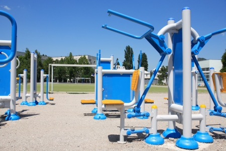 New modern outdoor exercise equipment under blue skyの写真素材